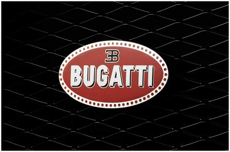 Sixty crimson dots that represent either pearls or protection wires are embedded into the slender white bordering. Bugatti Logos