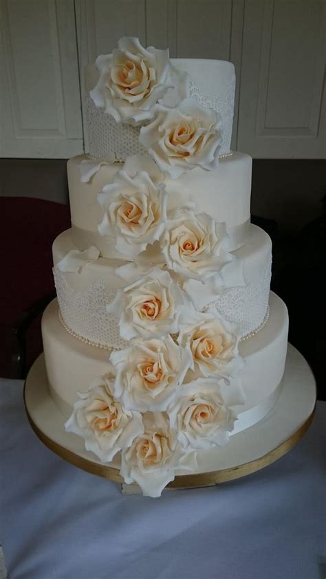 cascading golden roses  tier wedding cake cake  jos