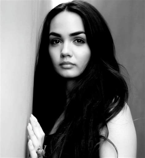 A Black And White Photo Of A Woman With Long Hair