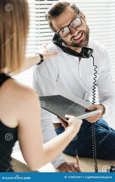 Handsome Smiling Businessman Talking On Rotary Telephone While