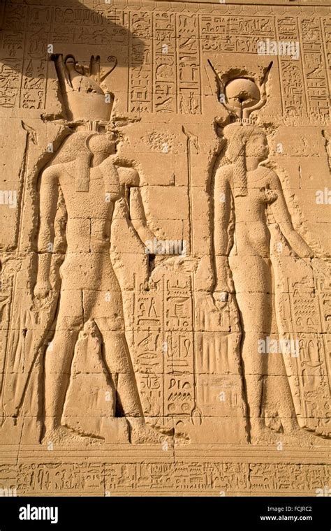 exterior relief depicting horus left and hathor right temple of hathor dendera egypt