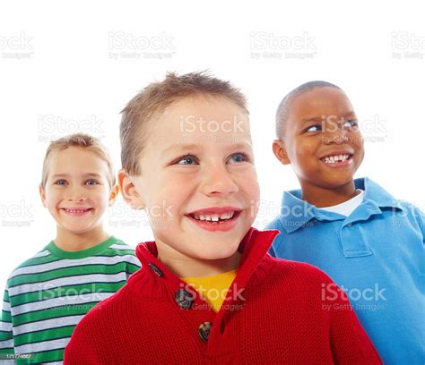 Three Cute Smiling Kids Looking Away Against White Background Stock