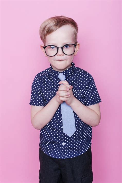 Portrait Of A Little Smiling Boy In A Funny Glasses And Tie School