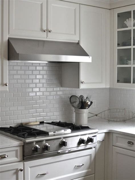 People do do a full tile back splash on top of a standard 4 stone splash, however, my suggestion would be that doing that tends to look like an after thought. Cambria Quartz countertops + crackled, beveled subway tile ...