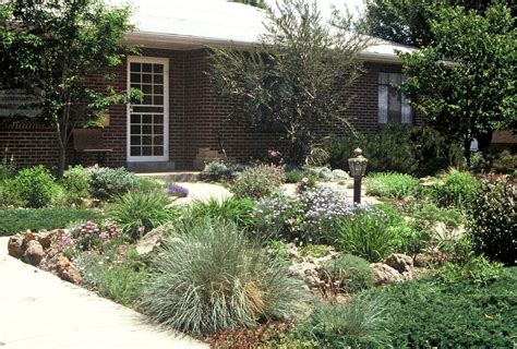 An equal balance of elements (grass, vegetation, fencing, etc.) will provide a big bang for your landscaping buck. Front Yard Landscaping Ideas No Grass | Examples and Forms