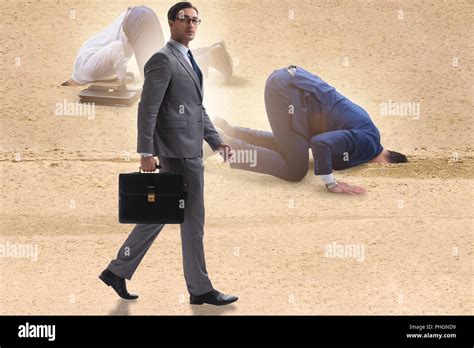 Businessman Hiding His Head In Sand Escaping From Problems Stock Photo