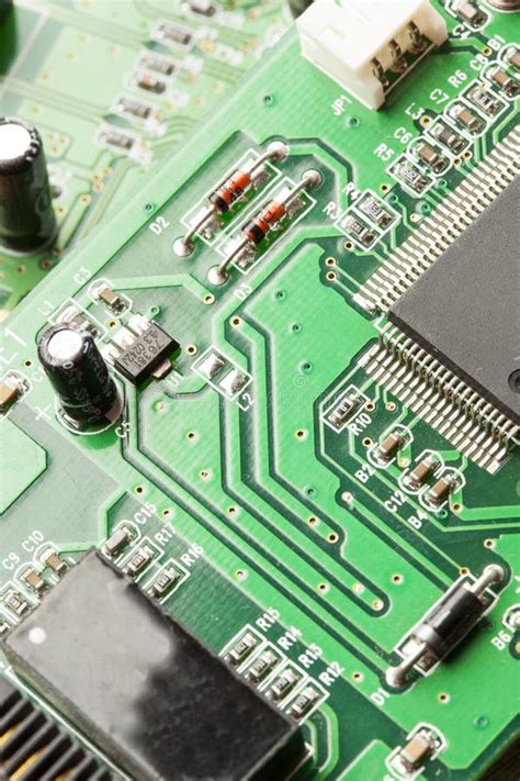 Green Electrical Circuit Board With Microchips And Transistors Stock
