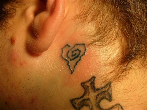 A star that has some swirling elements is a fun star indeed. Birds Tattoos For You: bird tattoo behind ear
