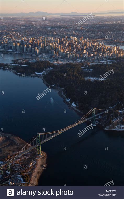 Aerial View Of Lions Gate Bridge Stanley Park And Downtown City During