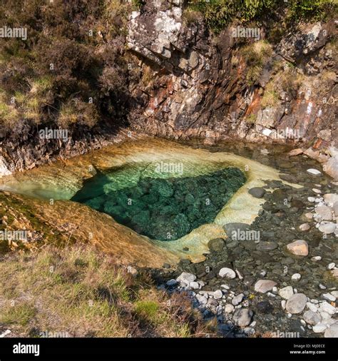 Rock Pool Eroded Into Skye White Marble Slab In Mountain Stream Bed Of