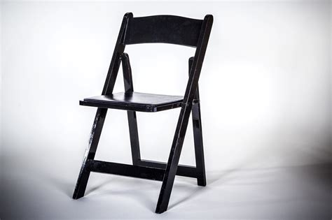 Flash furniture 2 pack hercules series black wood folding chair with vinyl padded seat. Black Resin Folding Chair | AM Party Rentals