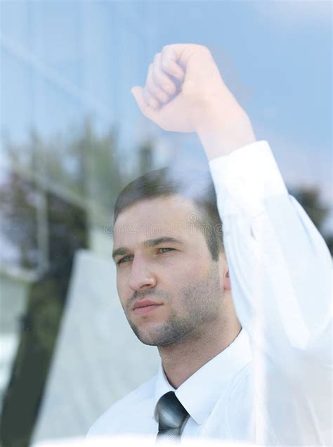 View From Behind Nfident Businessman Looking Out The Window Of