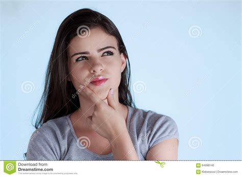 Woman With Thoughtful Expression And Hand On Chin Stock Photo Image