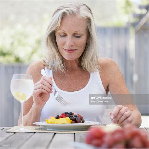 Woman Eating Breakfast High Res Stock Photo Getty Images