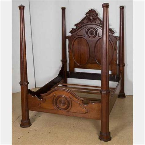 An American Victorian Carved Mahogany Four Poster Bed