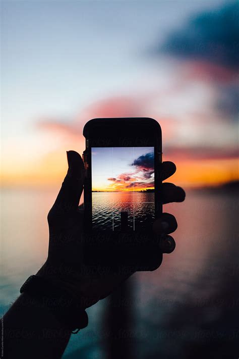 Someone Taking A Mobile Picture Of The Sunset by Kristen Curette ...