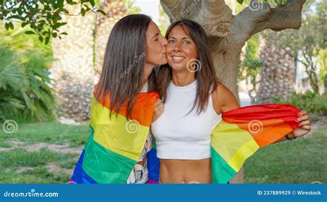 spanish lesbian couple posing with a pride flag stock image image of symbol embracing 237889929