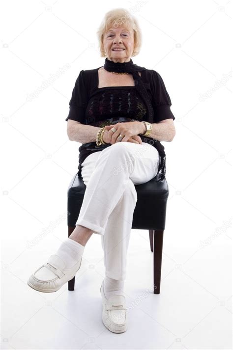 Old Woman Sitting On Chair And Relaxing Stock Photo Imagerymajestic