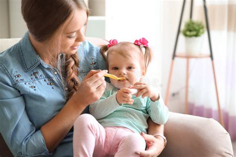 Caring Mother Feeding Her Cute Little Baby Stock Image Image Of Love