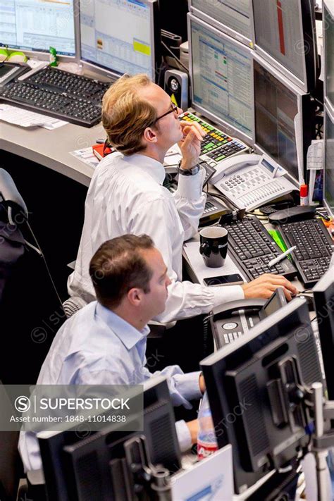Stockbrokers On The Trading Floor Of The Frankfurt Stock Exchange