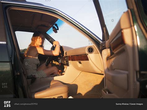 Woman Sitting In The Driver S Seat Of A Vehicle Stock Photo Offset