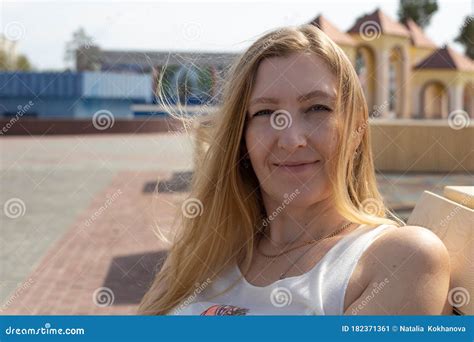 Portrait European Woman Blonde With Long Hair Smiling Outdoors On A Sunny Day Stock Image