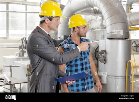 Worker With Supervisor Inspecting Industrial Area Stock Photo Alamy