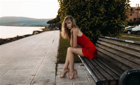 Model Sitting On Bench In Red Dress Wallpaperhd Girls Wallpapers4k