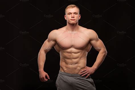 Athletic Handsome Man Fitness Model Showing Six Pack Abs Isolated On
