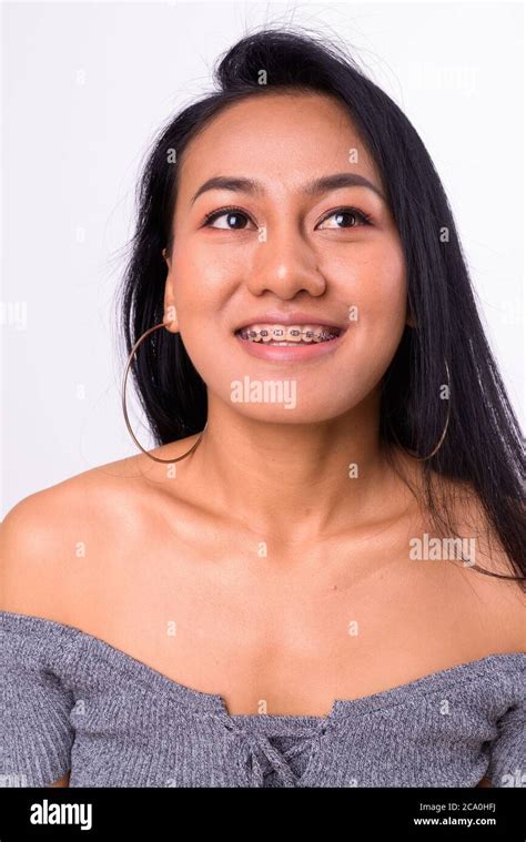 Portrait Of Happy Young Beautiful Asian Woman With Braces Stock Photo