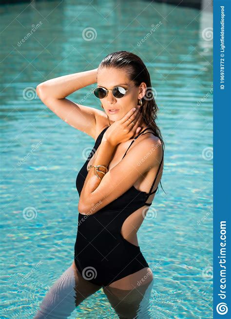 Woman In Sunglasses Posing In Swimming Pool Stock Photo Image Of