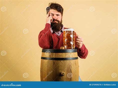 Beer Time Thoughtful Brewer With Mug Of Beer On Wooden Barrel Serious