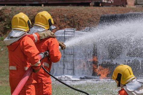 Premium Photo Firefighters Extinguish The Fire With A Chemical Foam
