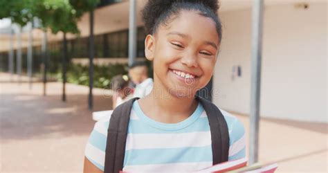 Schoolgirl Holding School Books And Smiles Happy Stock Photo Image Of