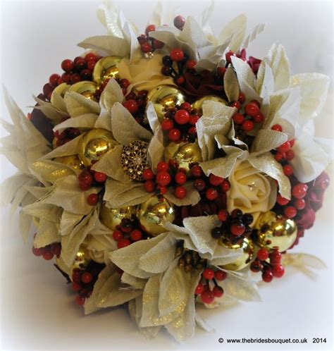 christmas wedding bouquet winter themed bridal flowers in deep red and gold poinsettia rose
