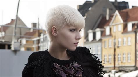 The pixie cut is also chic. Short cropped blond hair with a full fringe