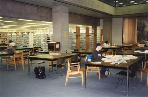 Photograph Of Students Working Tables In A Stack Reading Area In The