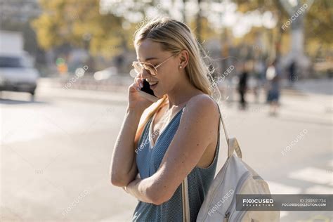 Young Woman Talking On Cell Phone In The City — Attractive Smartphone