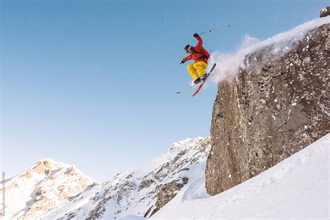 Extreme Skier Jumping From A High Cliff Del Colaborador De Stocksy Ibex Media Stocksy