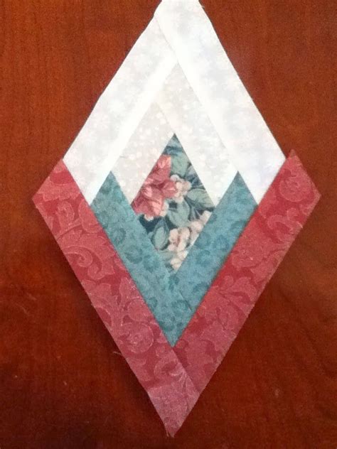 Log cabin blocks are composed of fabric strips, or logs, pieced around a center square. On Pins and Needles: Tuesday Tutorials: Diamond Log Cabin ...