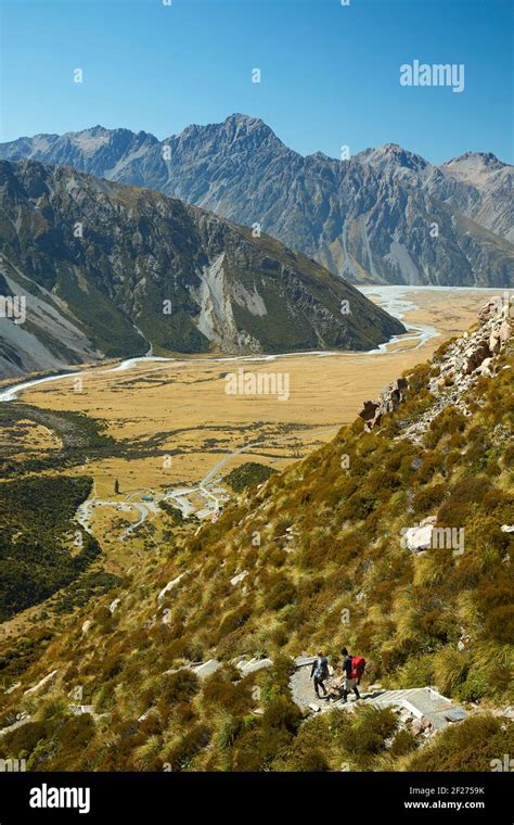 Hikers On Track To Sealy Tarns And Mueller Hut Aoraki Mount Cook