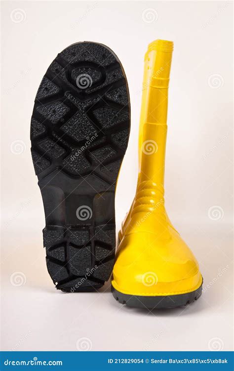 Waterproof Yellow Rubber Boots Isolated On White Background Stock Photo