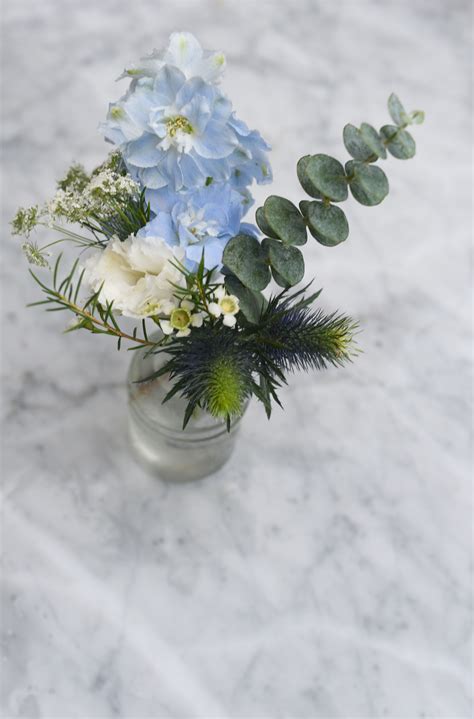 Mini Bud Vase Arrangement Featuring With White Blue Blooms And