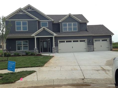Home is what you are, the exterior is the face of the house that everyone will see in the first part. Slate blue siding and shakers, white trim and garage door ...