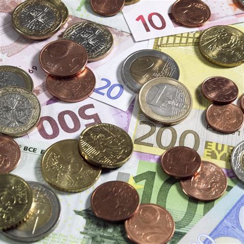 Euro Coins On 10 20 100 200 And 500 Euro Bank Notes Stock Photo