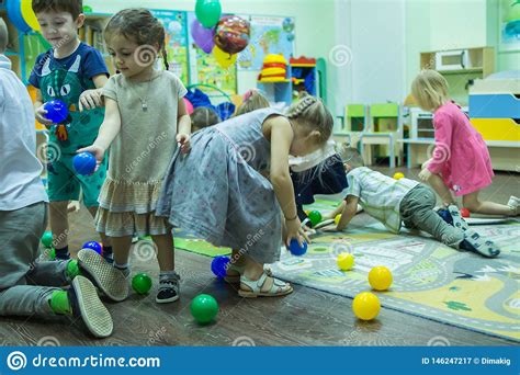 Children Playing Active Games In The Kindergarten Editorial