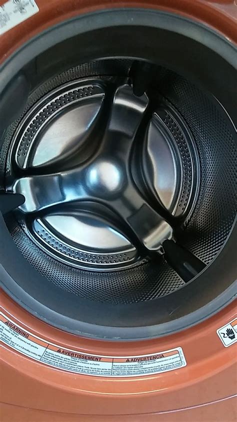 Orange Kenmore Elite Frontload Washer And Dryer Set On Pedestals For