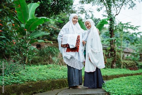 Beautiful Portrait Of Mother And Daughter Wearing Mukena Asian Muslim