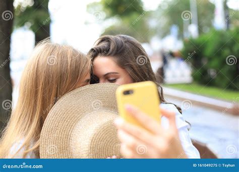 Two Women Friends Are Kissing Each Other For Fun Stock Image Image