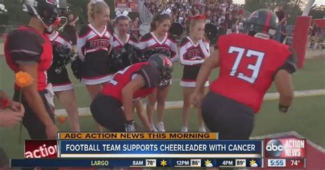 Football Players Honor Cheerleader With Cancer